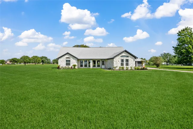 a view of a house with a big yard