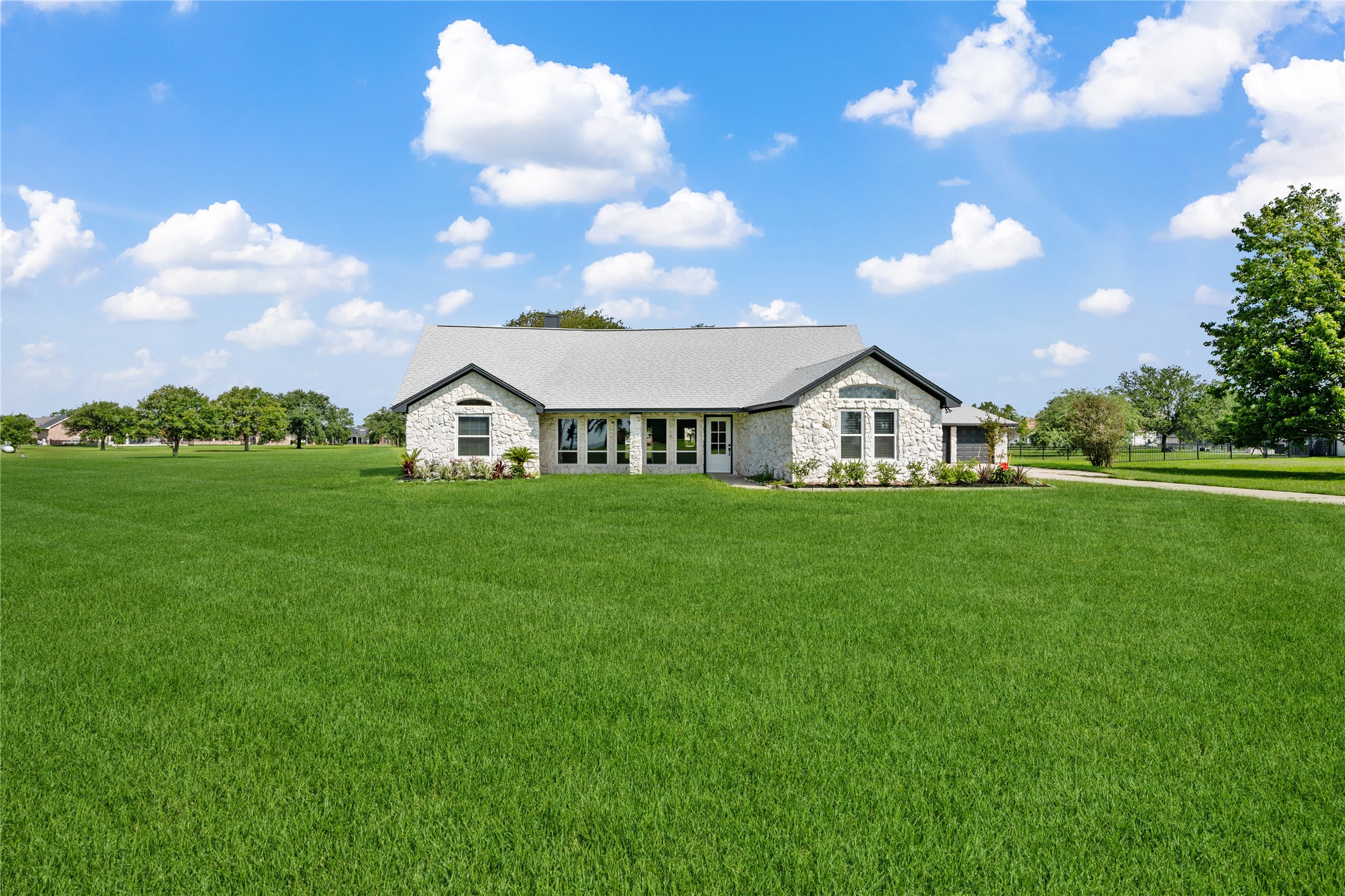 9035 Water Point Drive Beach City, TX 77523 - Photo 2 of 36 a view of a house with a big yard