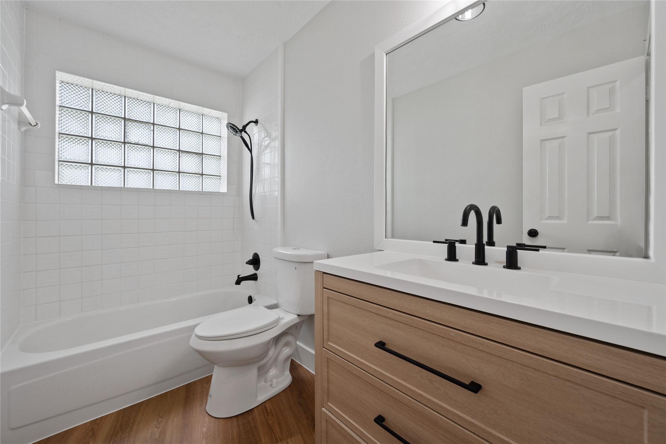 9035 Water Point Drive Beach City, TX 77523 - Photo 22 of 36 a bathroom with a sink a toilet and a bathtub