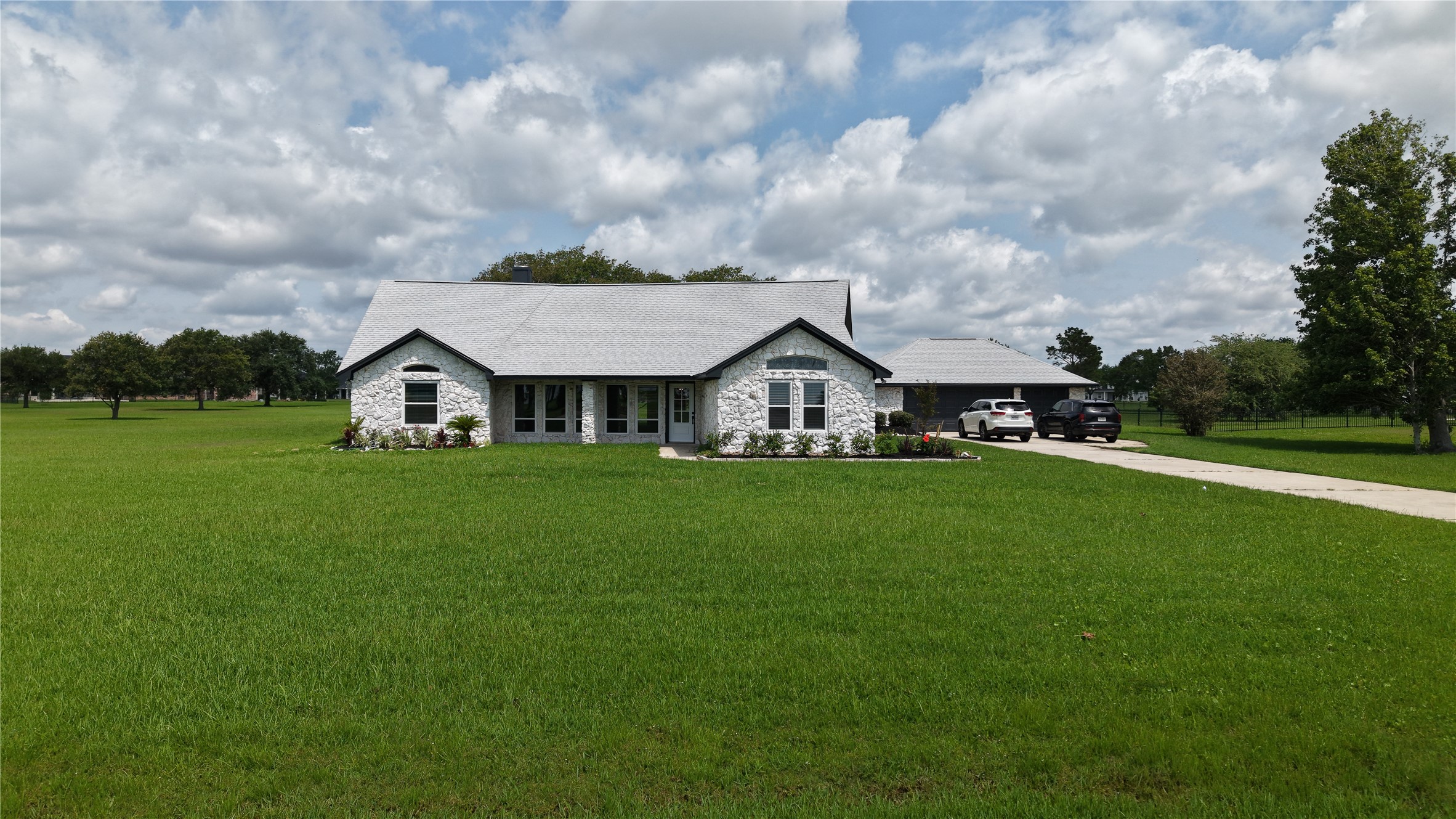 9035 Water Point Drive Beach City, TX 77523 - Photo 3 of 36 a view of house with garden