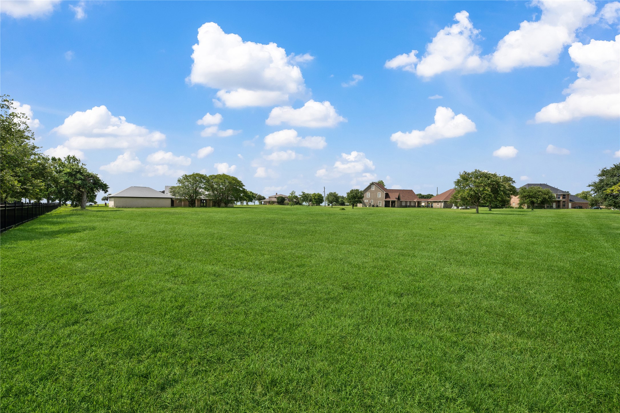 9035 Water Point Drive Beach City, TX 77523 - Photo 31 of 36 a view of a big yard with plants and large trees