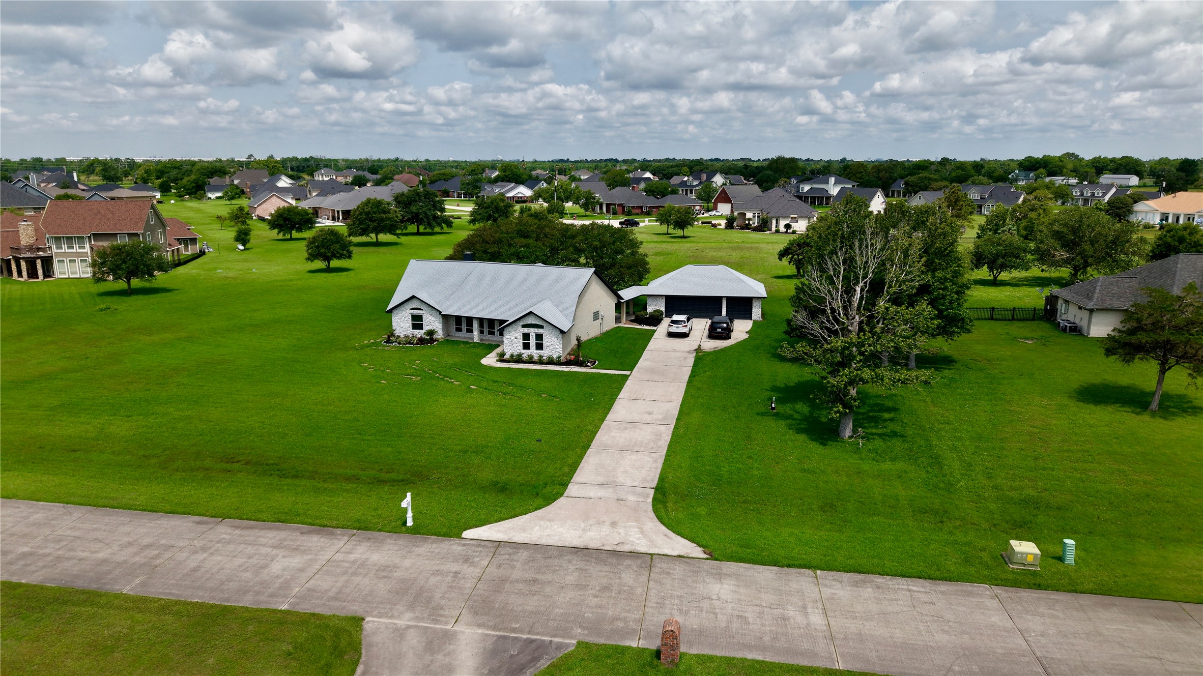 9035 Water Point Drive Beach City, TX 77523 - Photo 6 of 36 an aerial view of a house with garden space and street view