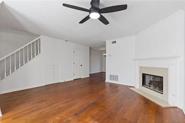 a view of a dining room with furniture wooden floor and chandelier