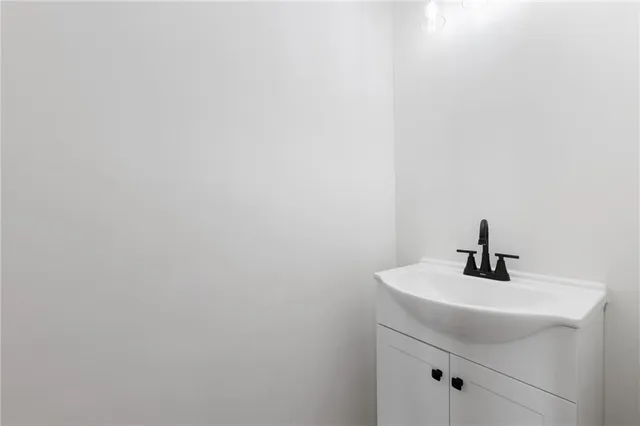 a bathroom with a sink and mirror