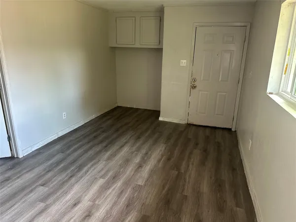 a view of wooden floor in an empty room