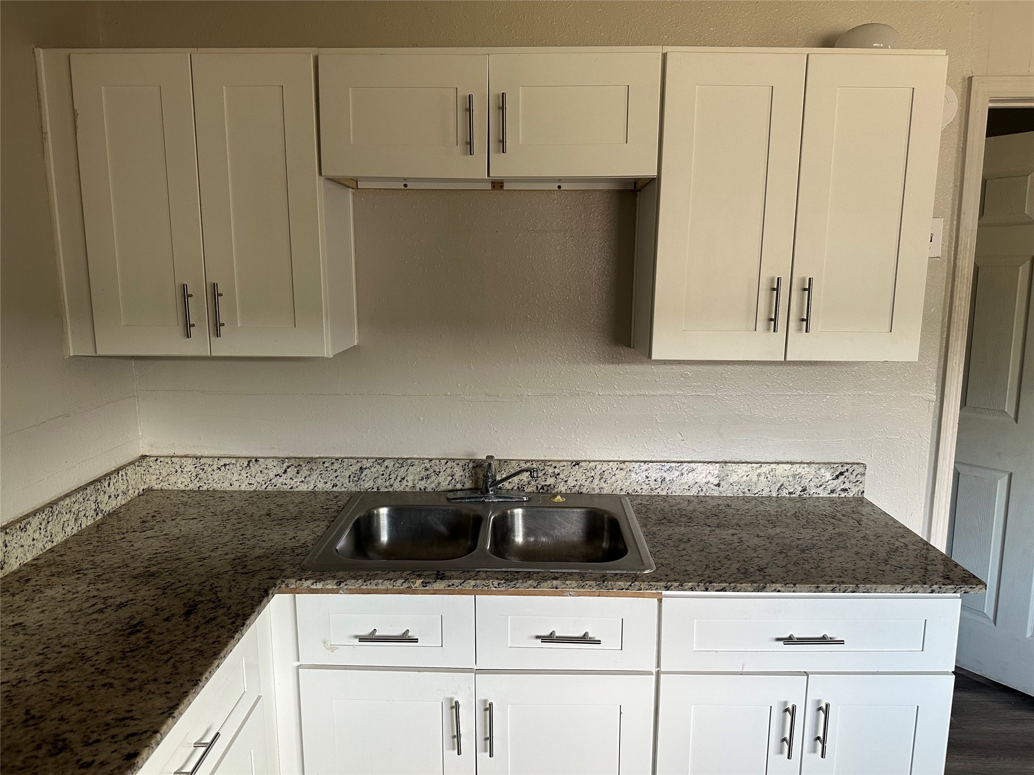 5409 Suez Street, Unit 4 Houston, TX 77020 - Photo 5 of 19 a white stove top oven sitting inside of a kitchen