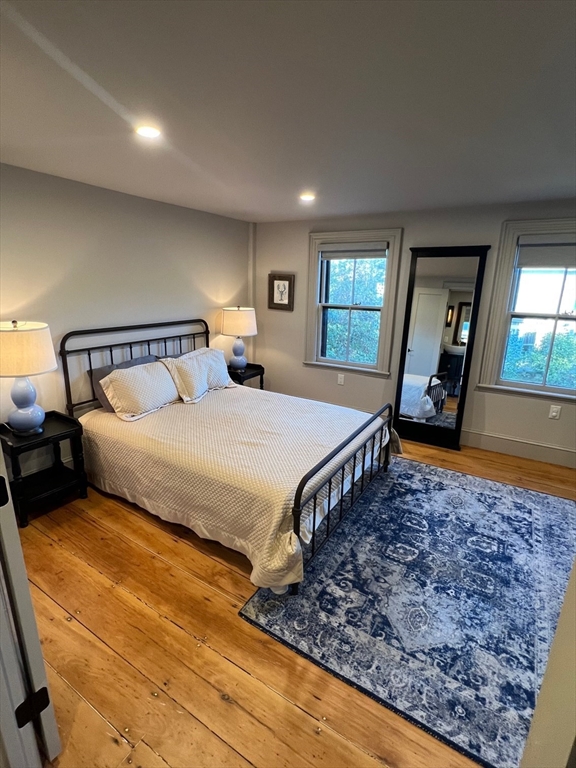 32 Buffum Street, Unit 1 Salem, MA 01970 - Photo 12 of 19 a bedroom with a large bed and a dresser