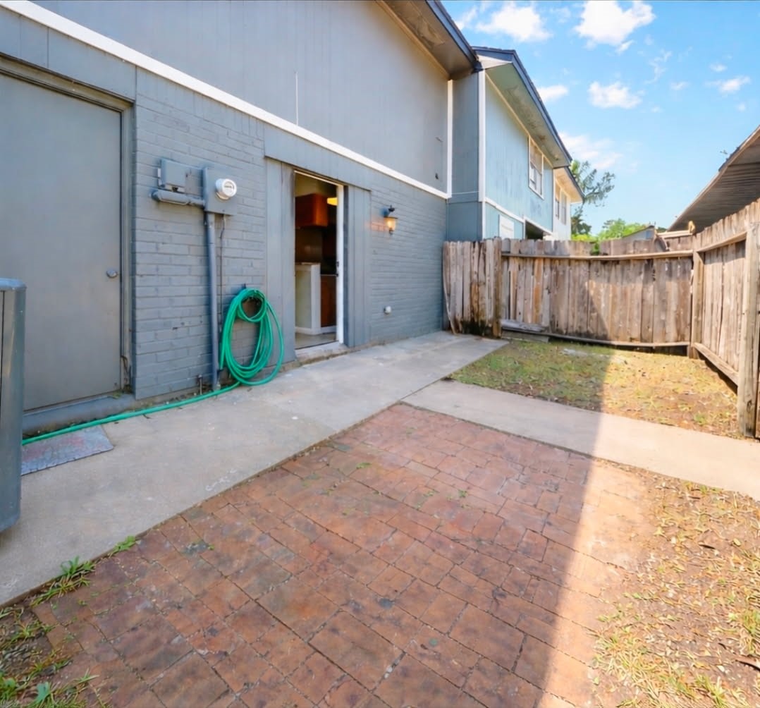 328 South 2nd Street, Unit 330 Alvin, TX 77511 - Photo 15 of 15 a view of a house with wooden fence