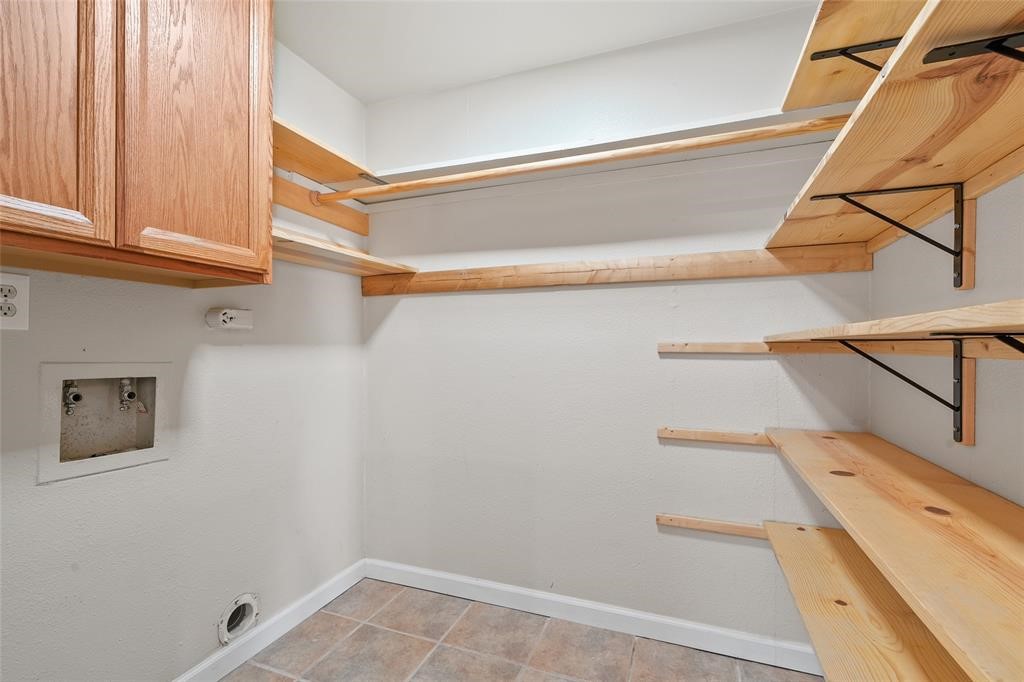 328 South 2nd Street, Unit 330 Alvin, TX 77511 - Photo 9 of 15 a view of storage and utility room with washer and dryer