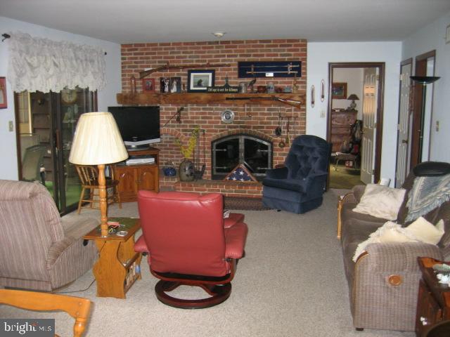 121 Royer Road Ephrata, PA 17522 - Photo 8 of 15 a living room with furniture and a fireplace