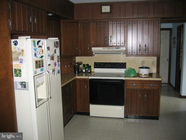 121 Royer Road Ephrata, PA 17522 - Photo 9 of 15 a kitchen with stainless steel appliances granite countertop a refrigerator and a stove