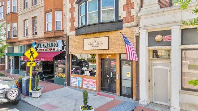 a view of a shop on the street