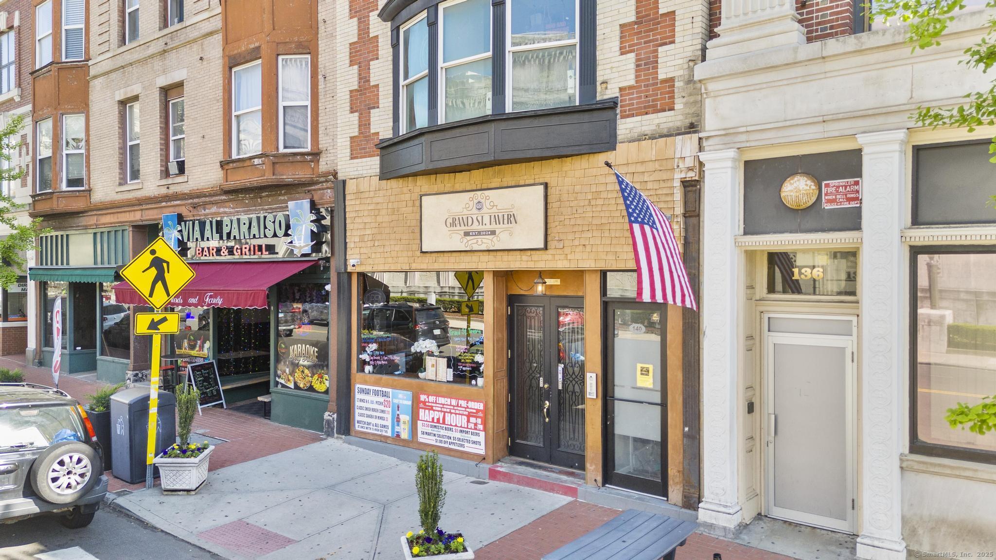 140 Grand Street, Unit 2C Waterbury, CT 06702 - Photo 2 of 13 a view of a shop on the street