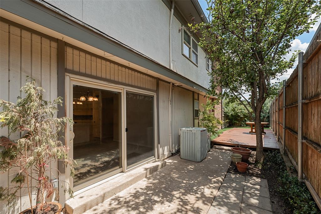 4988 Thunder Road Dallas, TX 75244 - Photo 28 of 32 Private paved patio area featuring a wooden privacy fence, and sliding glass door access