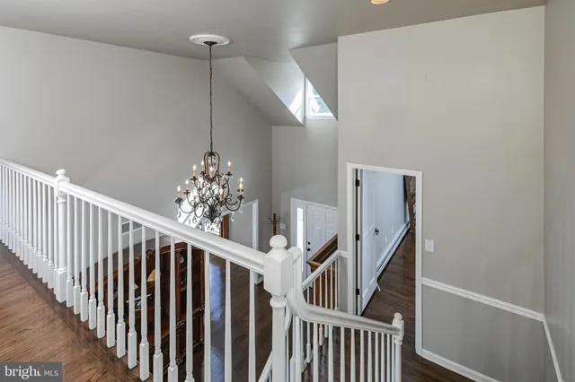 a view of a hallway with stairs