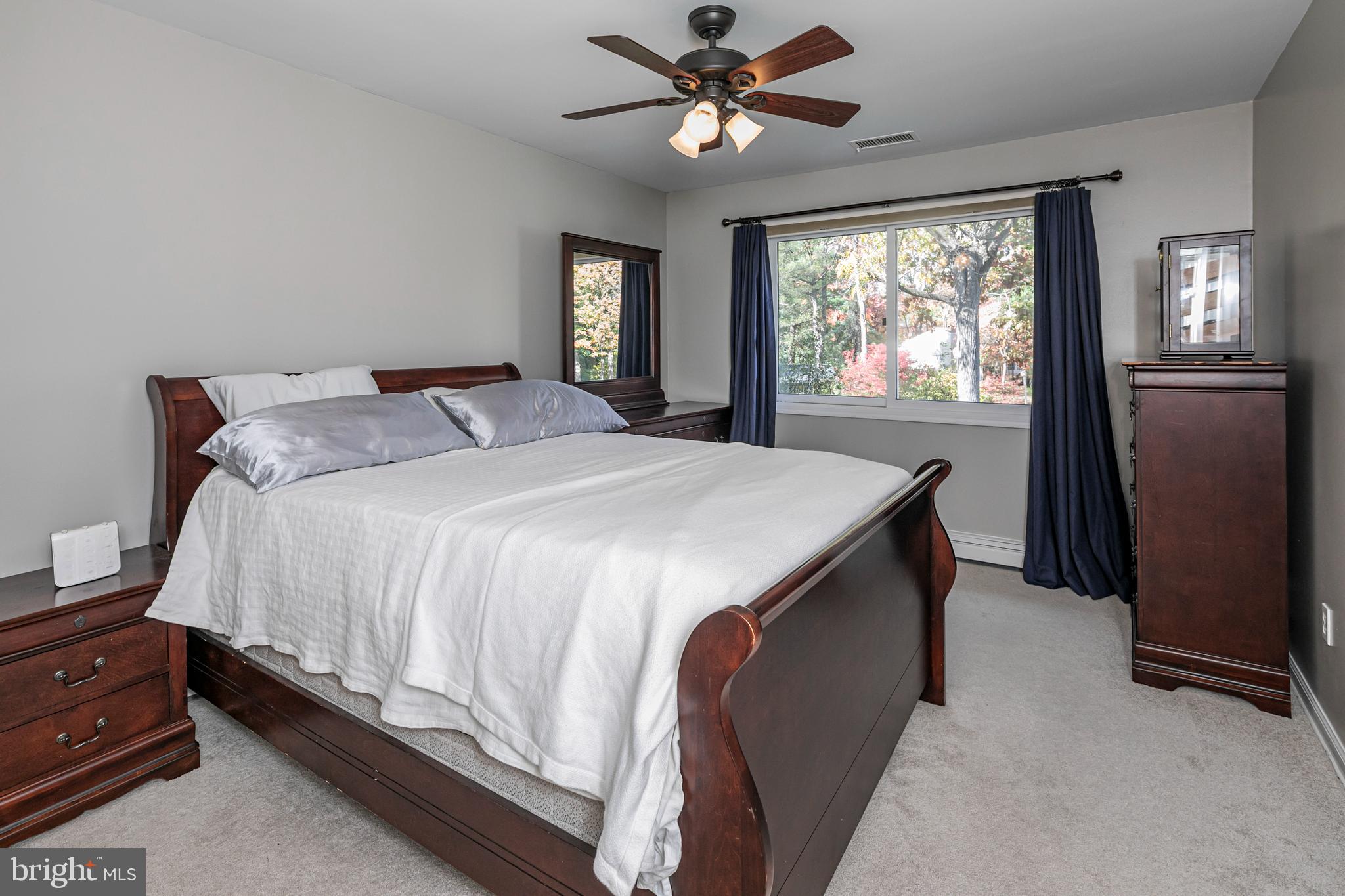 45 Willow Road Lawrenceville, NJ 08648 - Photo 25 of 32 a spacious bedroom with a bed and a chandelier