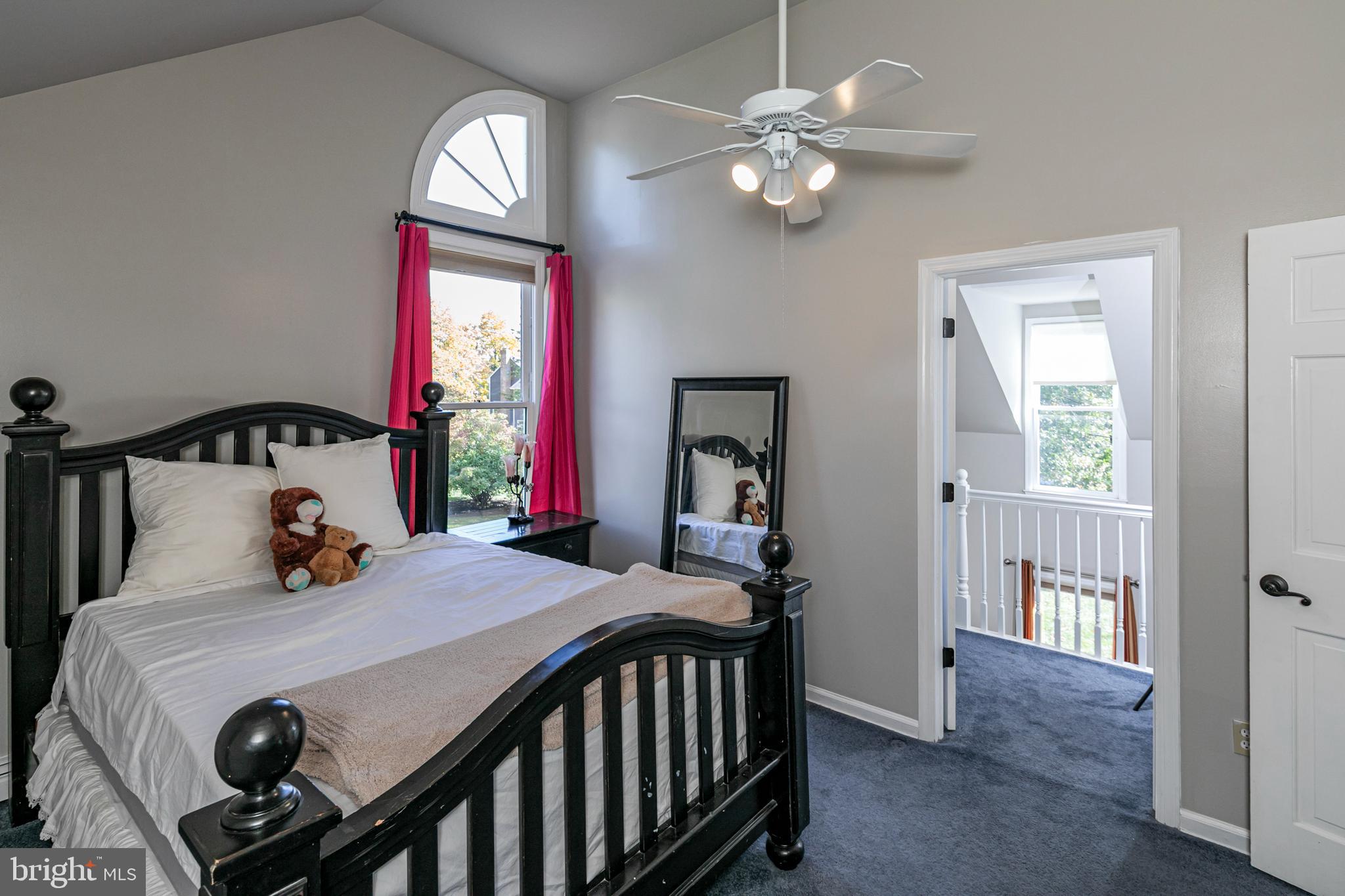 45 Willow Road Lawrenceville, NJ 08648 - Photo 27 of 32 a bedroom with a bed and a chandelier