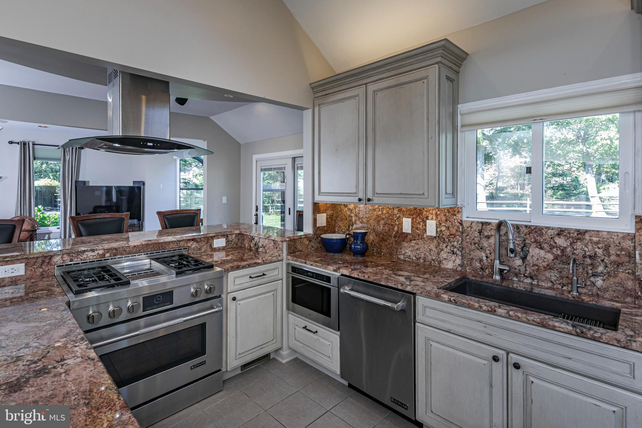 45 Willow Road Lawrenceville, NJ 08648 - Photo 8 of 32 a kitchen with stainless steel appliances granite countertop a stove a sink and a white cabinets