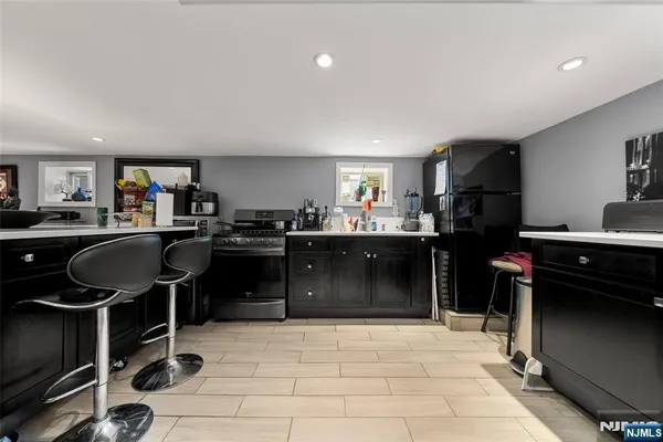 a bathroom with a sink mirror vanity and toilet