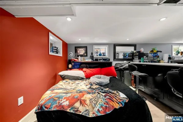 a view of a patio with table and chairs with wooden floor and fence