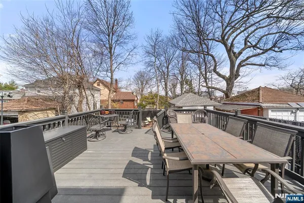 a backyard of a house with outdoor seating