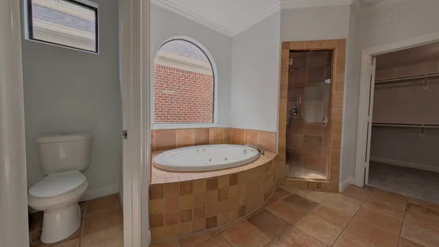 a bathroom with a toilet a sink and a mirror