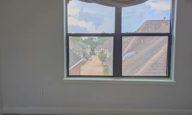 a bathroom with a granite countertop sink a toilet and a mirror