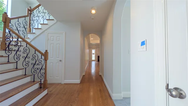 a view of entryway with stairs and wooden floor