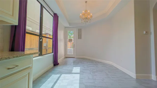 a view of an entryway with chandelier