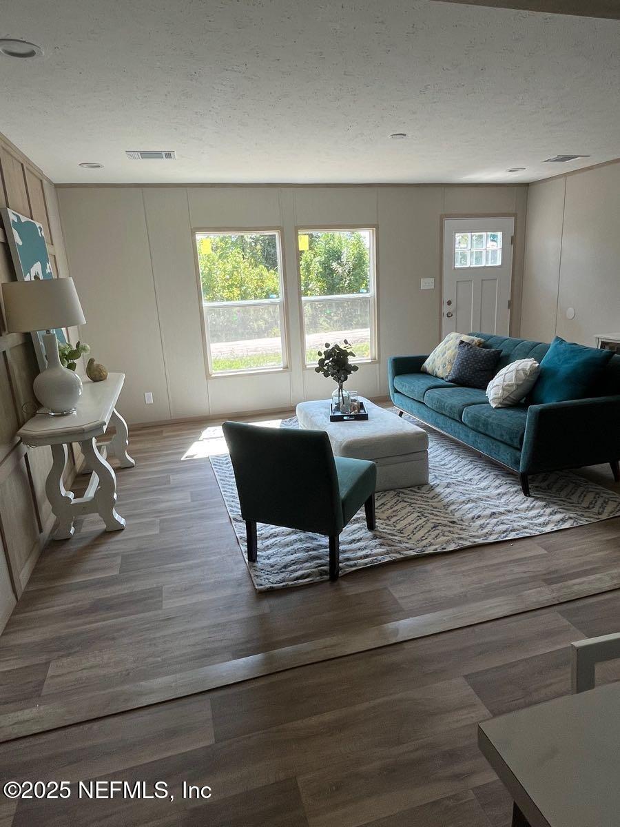 45692 Jones Way Callahan, FL 32011 - Photo 2 of 31 a living room with furniture and a large window