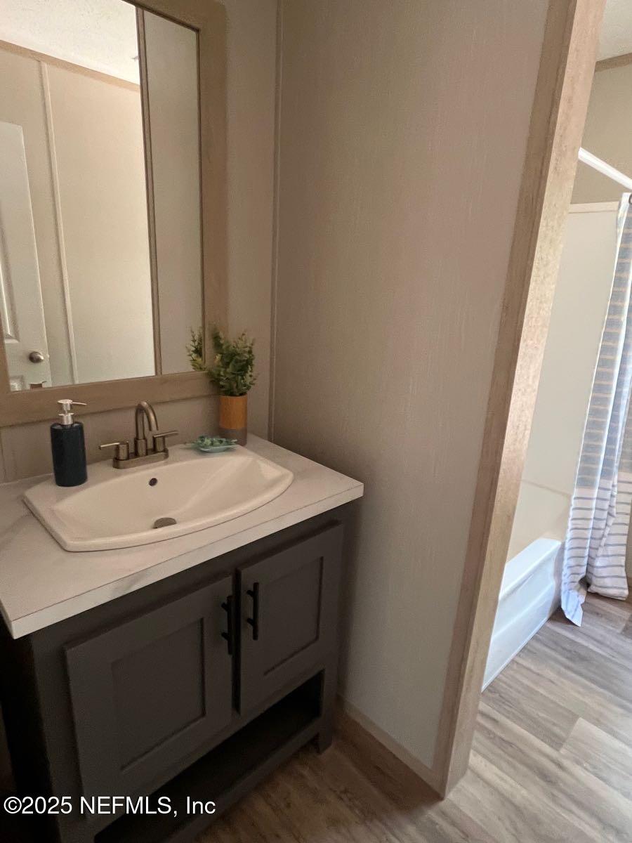45692 Jones Way Callahan, FL 32011 - Photo 25 of 31 a bathroom with a sink and a mirror