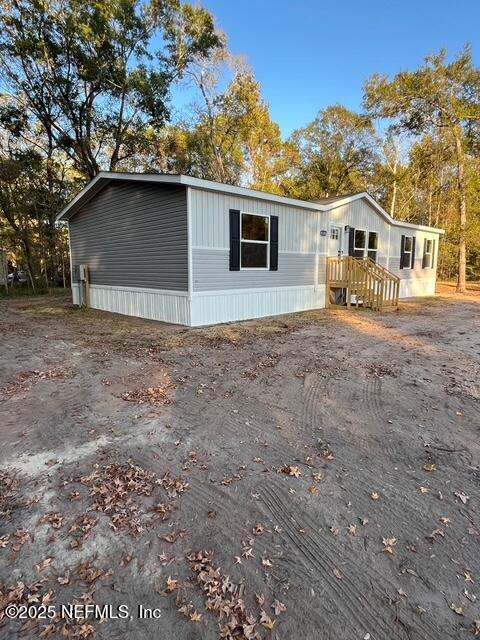 45692 Jones Way Callahan, FL 32011 - Photo 30 of 31 a house with trees in the background