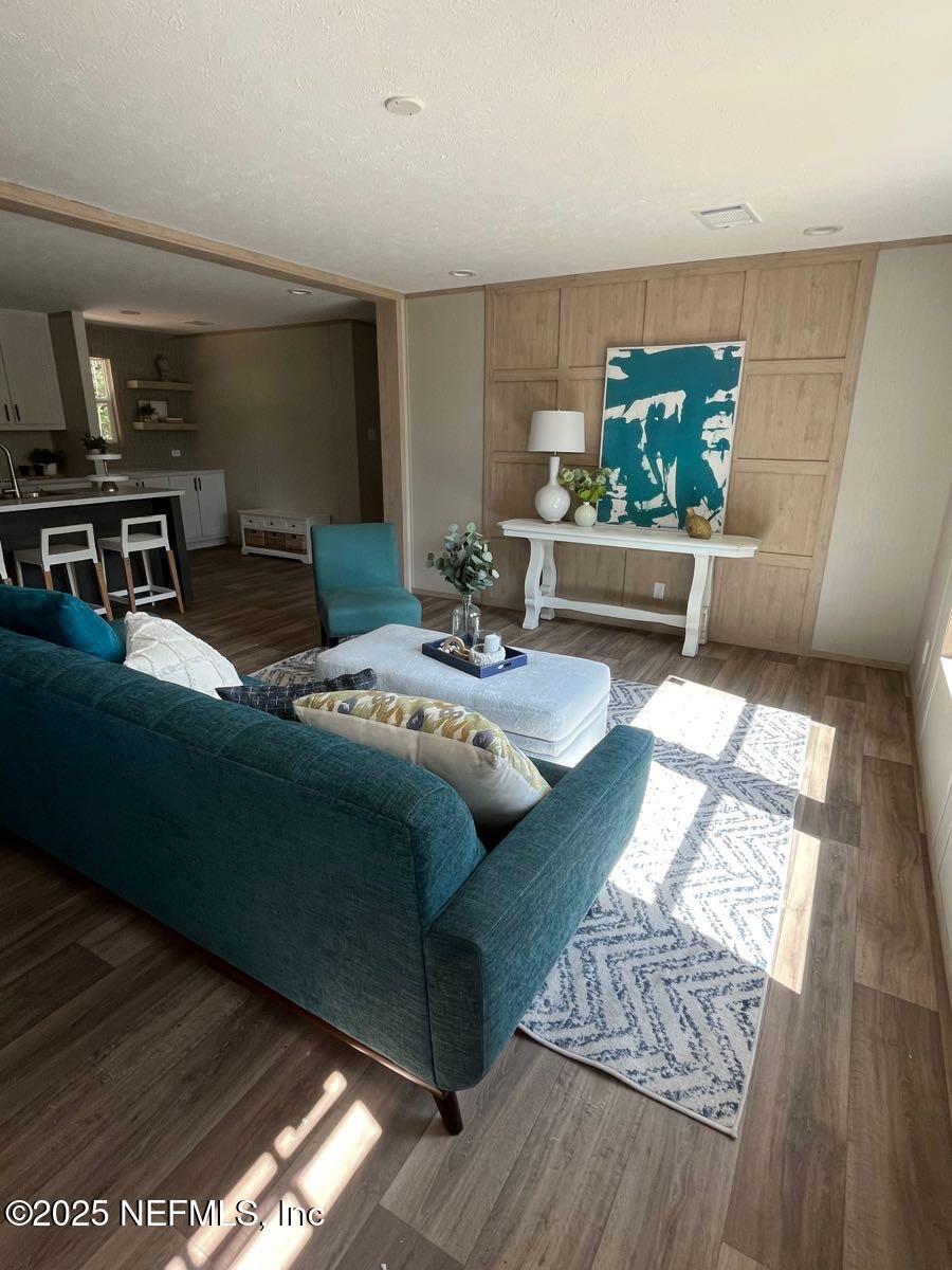 45692 Jones Way Callahan, FL 32011 - Photo 3 of 31 a living room with furniture and a table