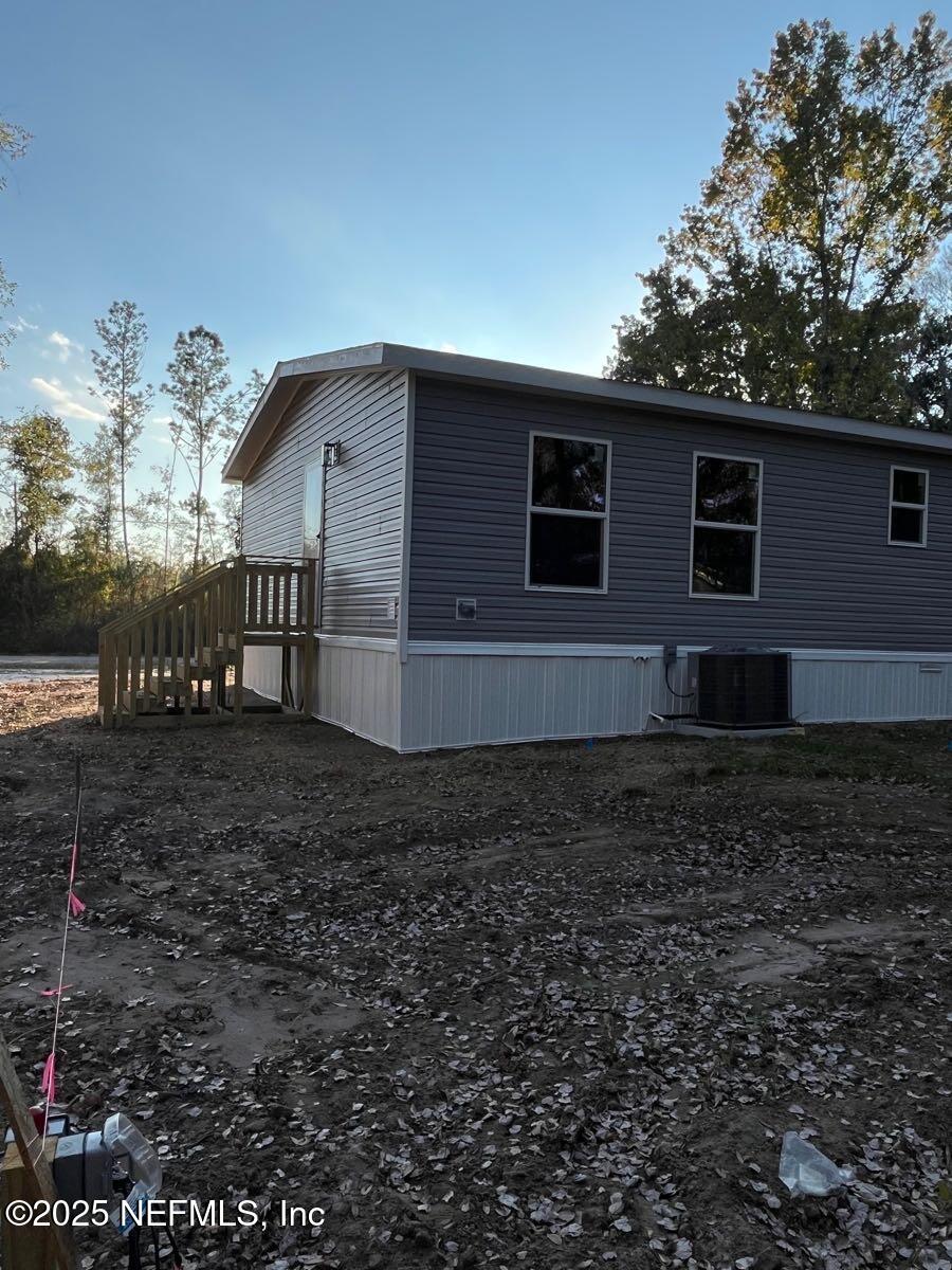 45692 Jones Way Callahan, FL 32011 - Photo 31 of 31 a view of a house with a yard
