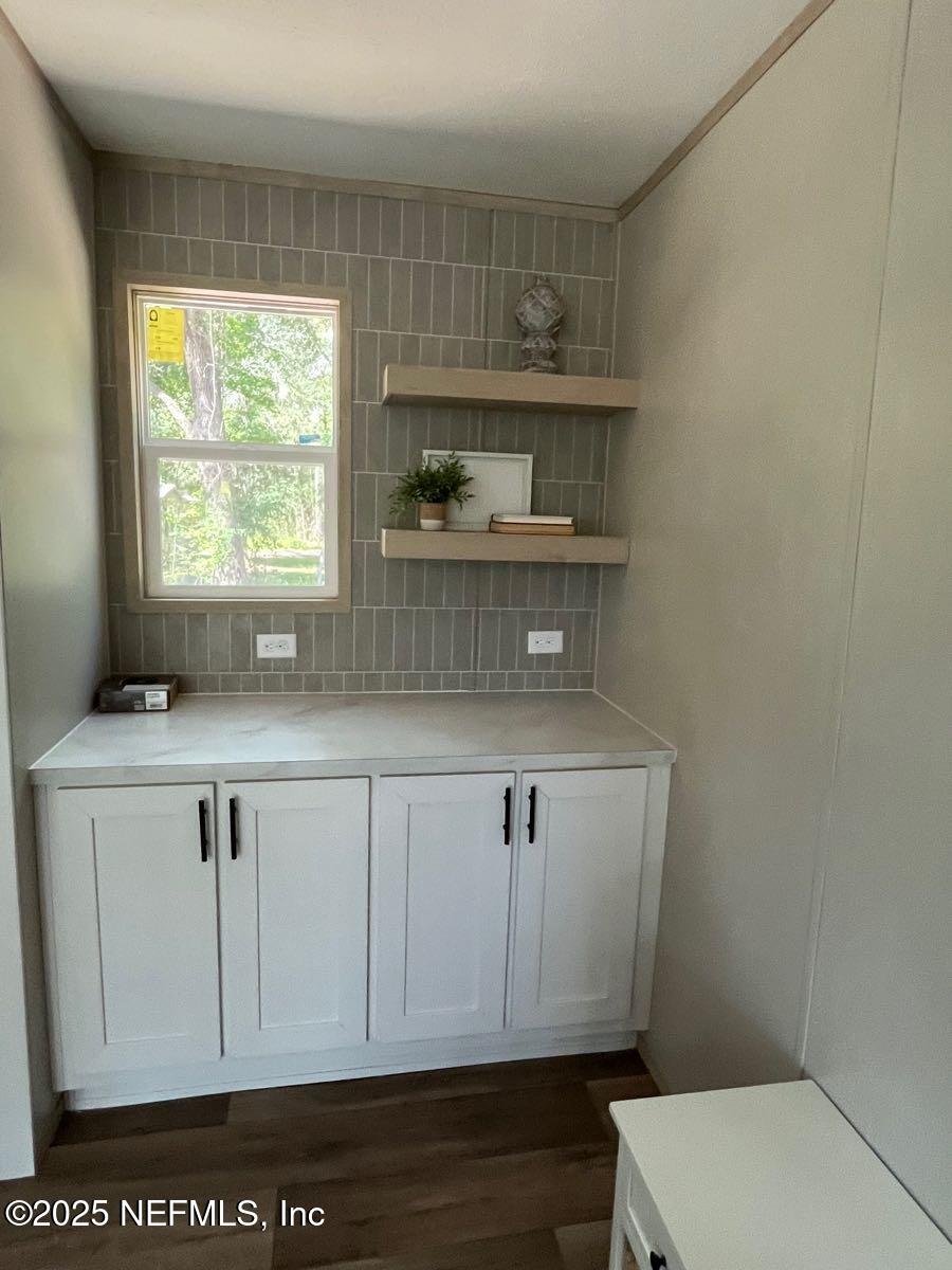 45692 Jones Way Callahan, FL 32011 - Photo 10 of 31 a bathroom with a sink a toilet and a window