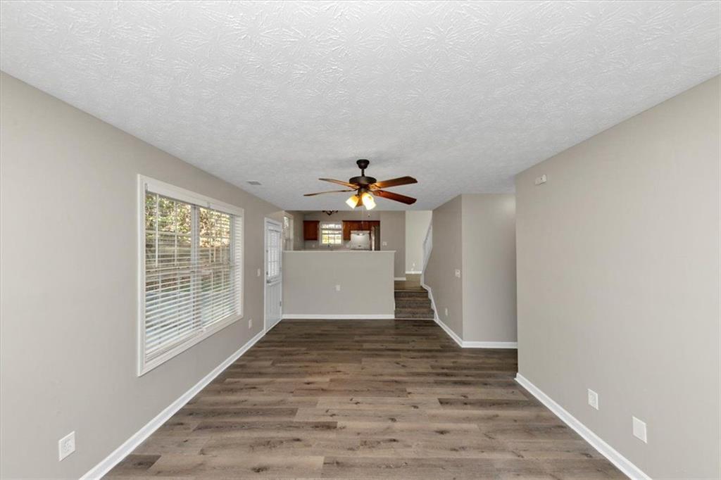 4169 Riverbank Court Decatur, GA 30034 - Photo 12 of 32 a view of an empty room with wooden floor and a window