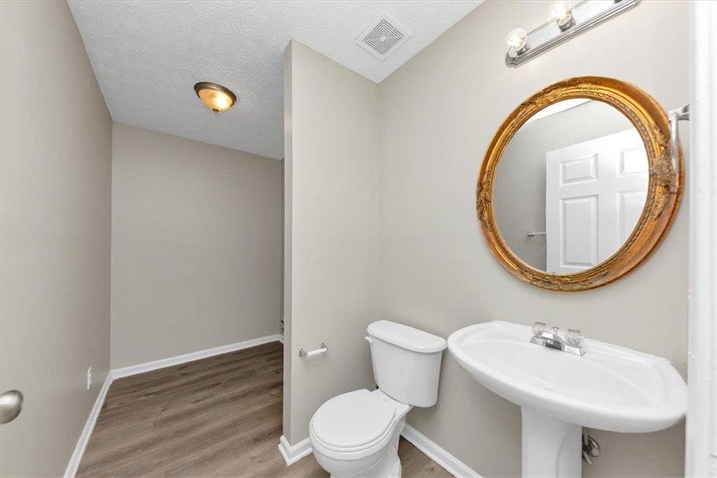 4169 Riverbank Court Decatur, GA 30034 - Photo 13 of 32 a bathroom with a sink and a mirror
