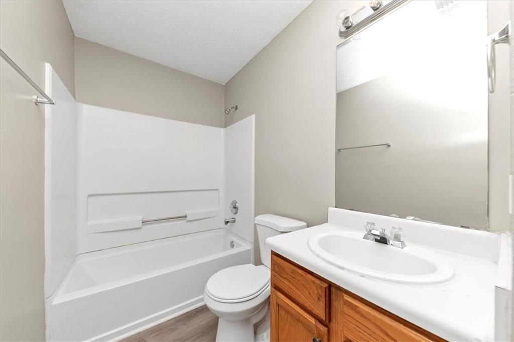 4169 Riverbank Court Decatur, GA 30034 - Photo 19 of 32 a bathroom with a sink a toilet and a bathtub