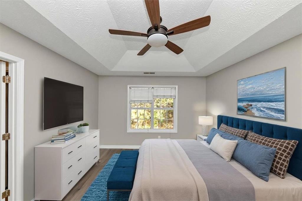 4169 Riverbank Court Decatur, GA 30034 - Photo 20 of 32 a bedroom with a bed and a flat screen tv