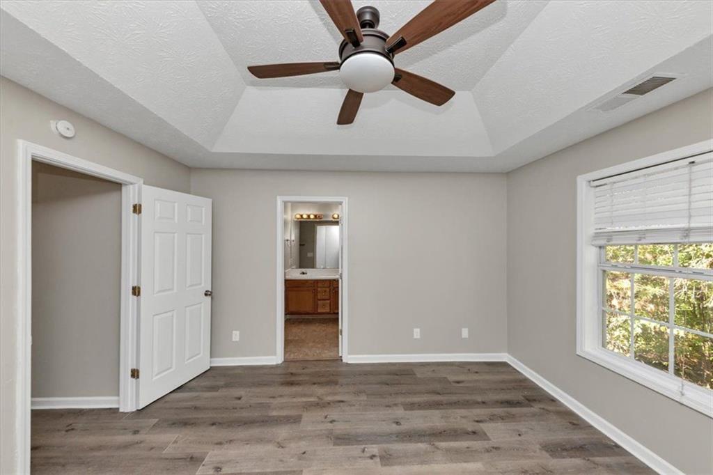 4169 Riverbank Court Decatur, GA 30034 - Photo 22 of 32 wooden floor in an empty room with a window