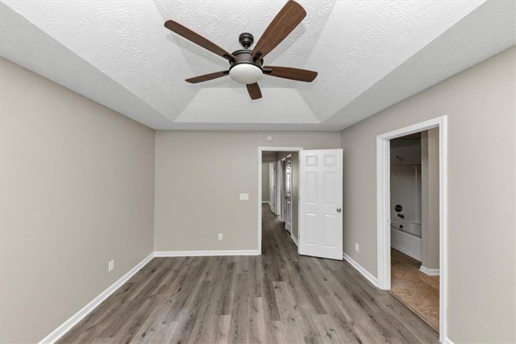 4169 Riverbank Court Decatur, GA 30034 - Photo 23 of 32 a view of an empty room with wooden floor