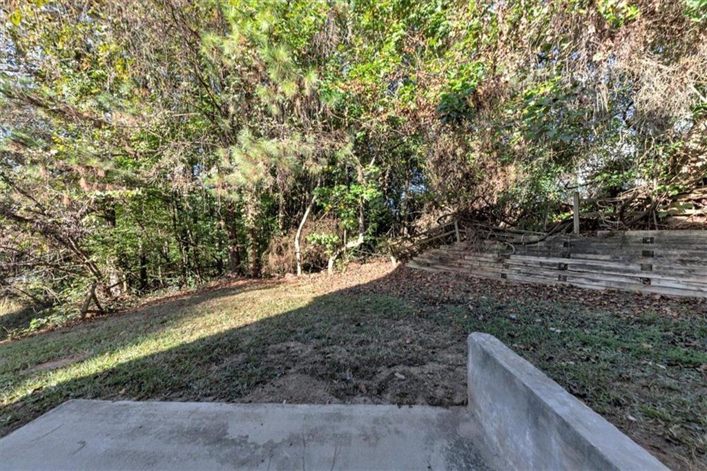 4169 Riverbank Court Decatur, GA 30034 - Photo 31 of 32 a view of a yard with plants and trees