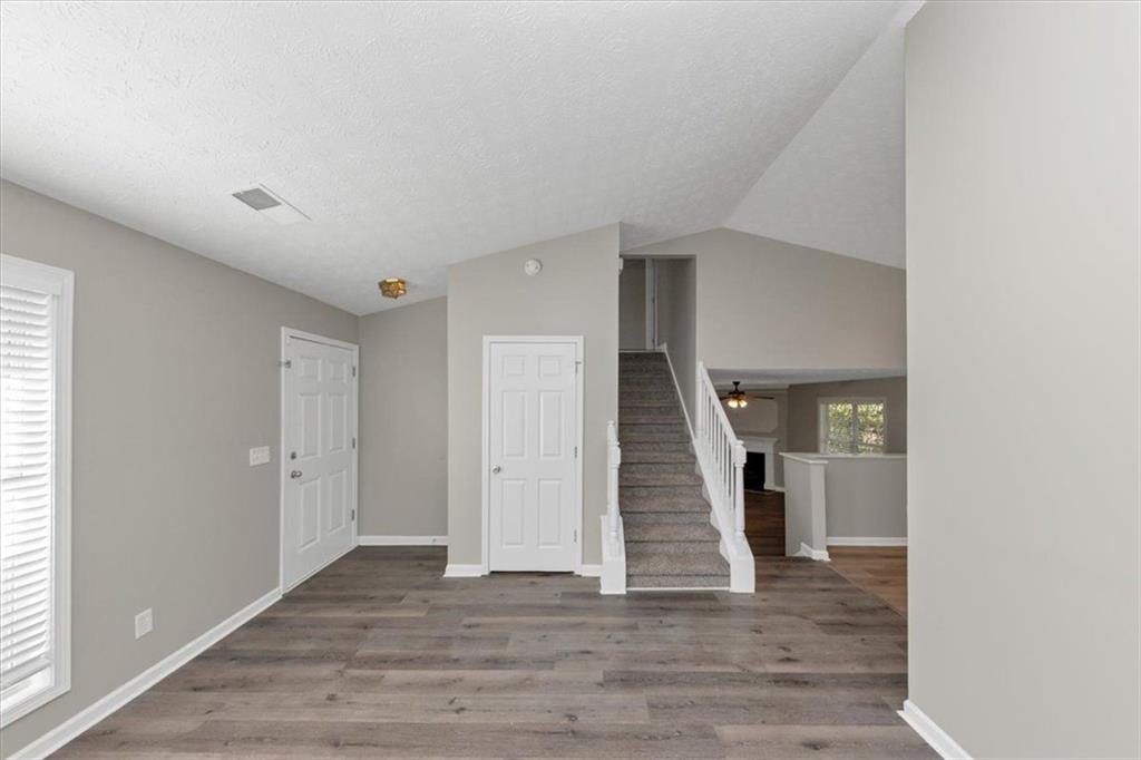 4169 Riverbank Court Decatur, GA 30034 - Photo 4 of 32 an empty room with wooden floor and entryway