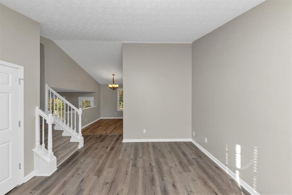 4169 Riverbank Court Decatur, GA 30034 - Photo 5 of 32 a view of livingroom with stairs and wooden floor