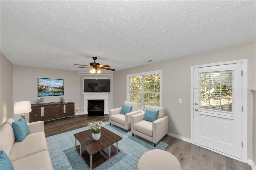 4169 Riverbank Court Decatur, GA 30034 - Photo 10 of 32 a living room with furniture fireplace and window