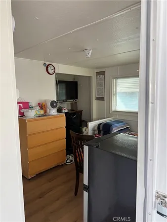 a room with a sink and a refrigerator