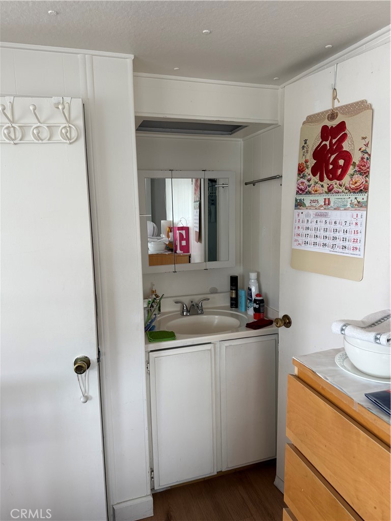 4117 West McFadden Avenue Santa Ana, CA 92704 - Photo 16 of 26 a room with a sink and a refrigerator