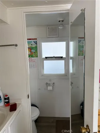 a bathroom with a glass shower door