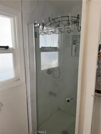 a white toilet sitting next to a sink