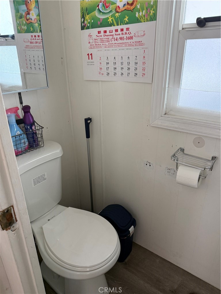 4117 West McFadden Avenue Santa Ana, CA 92704 - Photo 19 of 26 a white toilet sitting next to a sink